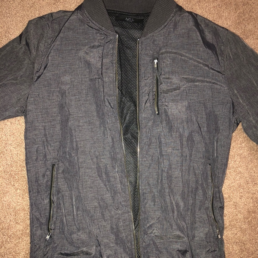 Light grey jacket with mesh on the inside.
